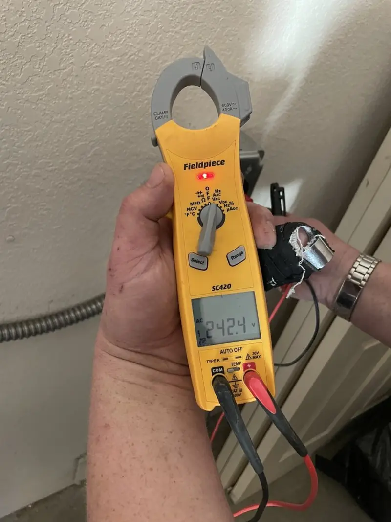 Voltage testing with clamp meter during Generator Installation in Chackbay